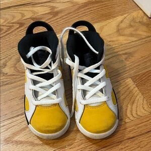 Jordan’s, size 10C, white and Yellow, fair condition.